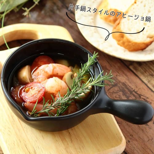 A stylish, black, 12cm small, heat-resistant, ceramic skillet for ajillo, microwave, oven, and stovetop use. Made in Japan by Banko ware.