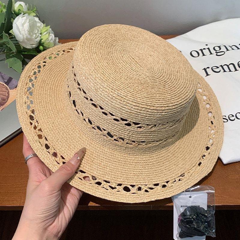 New hollow flat top Lafite straw hat women's summer new seaside beach sun hat French elegant straw top hat