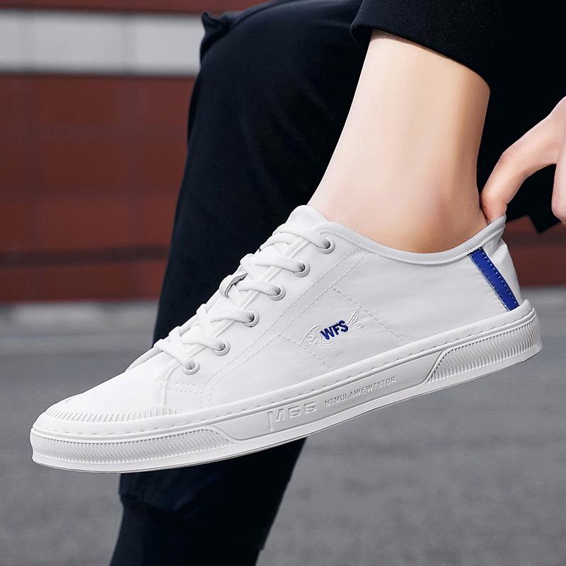 Four Seasons Men's White Canvas Shoes: Korean Style, Casual, Breathable, Lace-up, Low-top Fashion Sneakers.