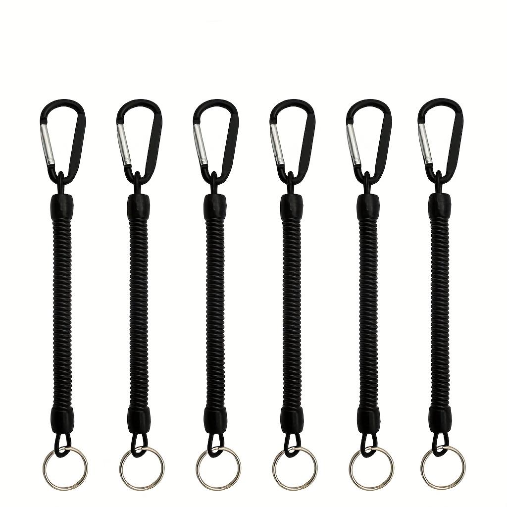 Черный пружинный брелок-катушка с выдвижным ремешком на запястье, расширяемый от 21,49 см до 119,38 см, со встроенным стальным тросом, выдерживает до 6,8 кг.