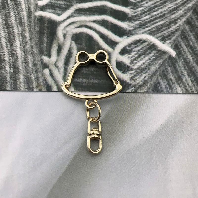Handmade Metal Rotating Chick Keychain with Christmas Bell and Color Retention.