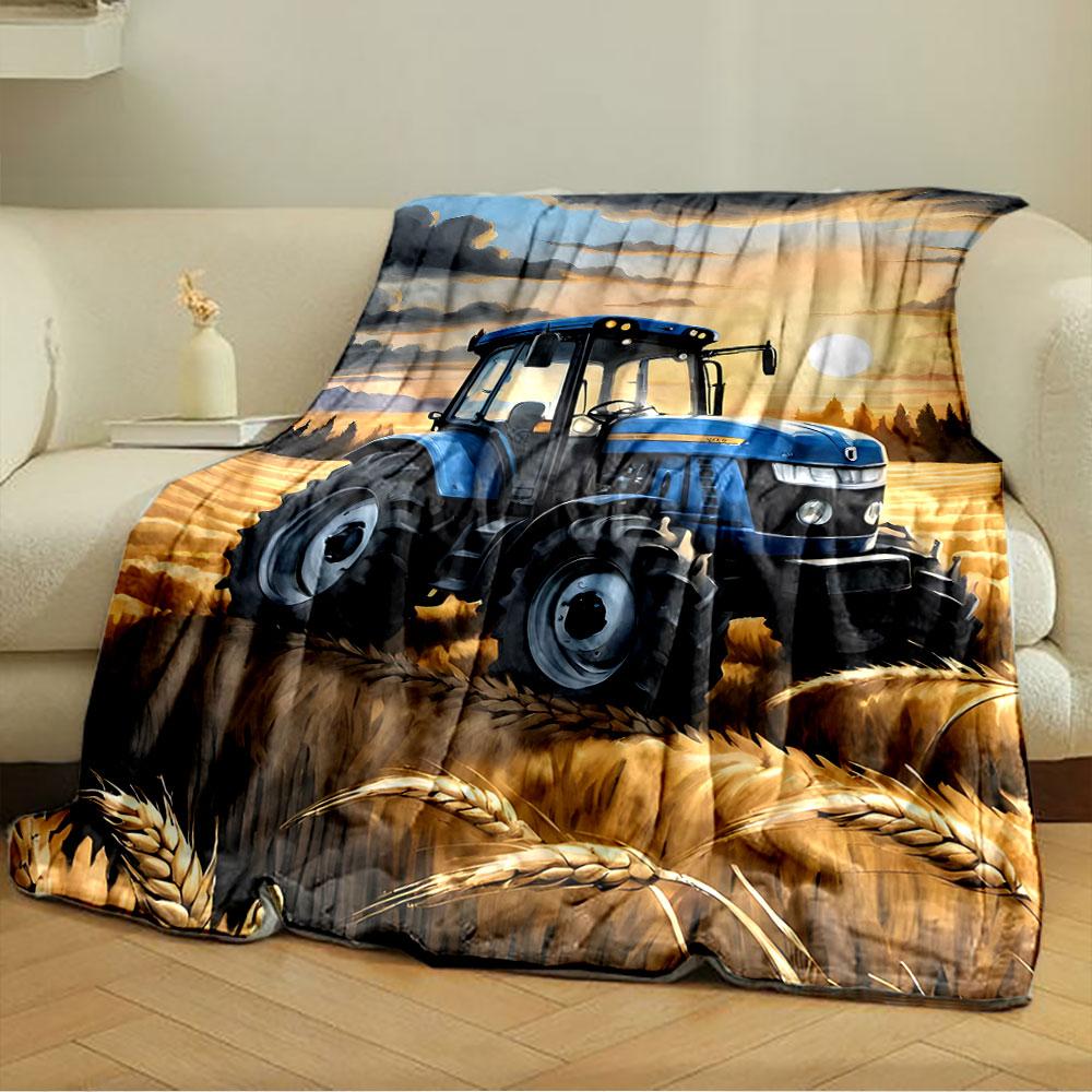 A blue tractor in golden wheat fields under a sunset sky with clouds. for all seasons blanket lunch break throw gift