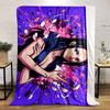 A woman with flowing petals on a vibrant purple and pink splatter background. for all seasons blanket lunch break throw gift
