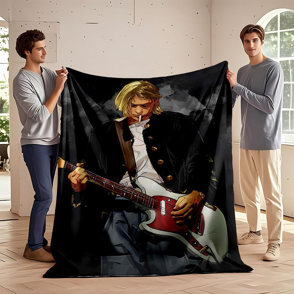 The main pattern shows a person playing a red-and-white electric guitar. for all seasons blanket lunch break throw gift