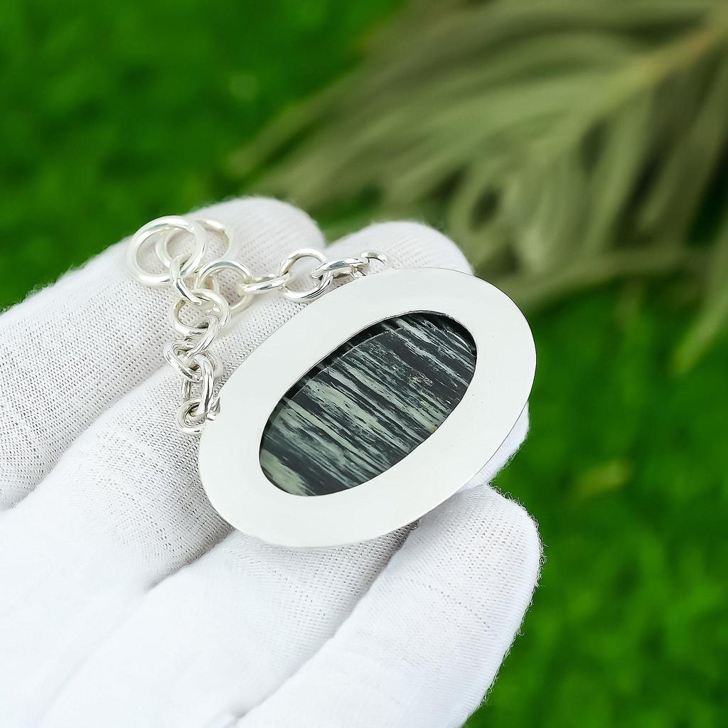 Подарок для нее Подвеска из серебра 925 пробы с натуральным серебристым яшмовым самоцветом в форме листа