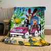 Animals happily driving a pink car surrounded by vibrant flowers. for all seasons blanket lunch break throw gift
