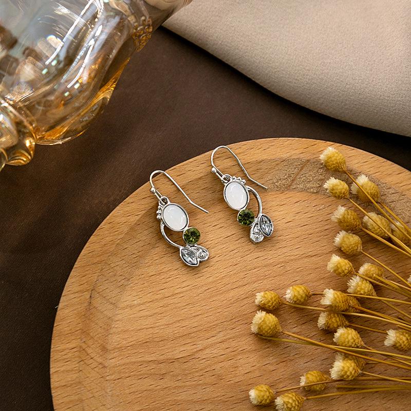 "European & American Retro Turquoise Feather Earrings: Bohemian Dragonfly, Bird, Water Drop, Round, & Pearl Designs"