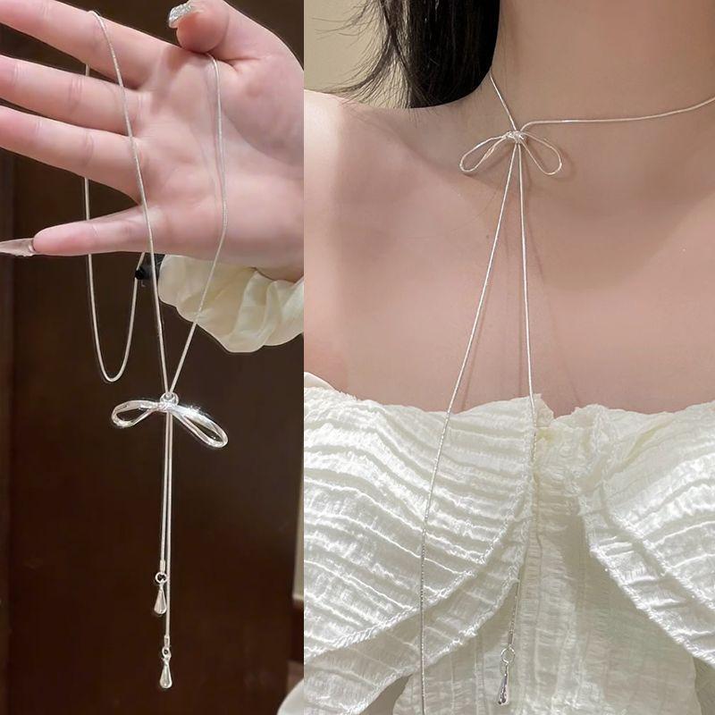 Серебряное длинное ожерелье с бахромой и бантом, новое модное, универсальное, с чувством дизайна, цепочка на ключицу, женское