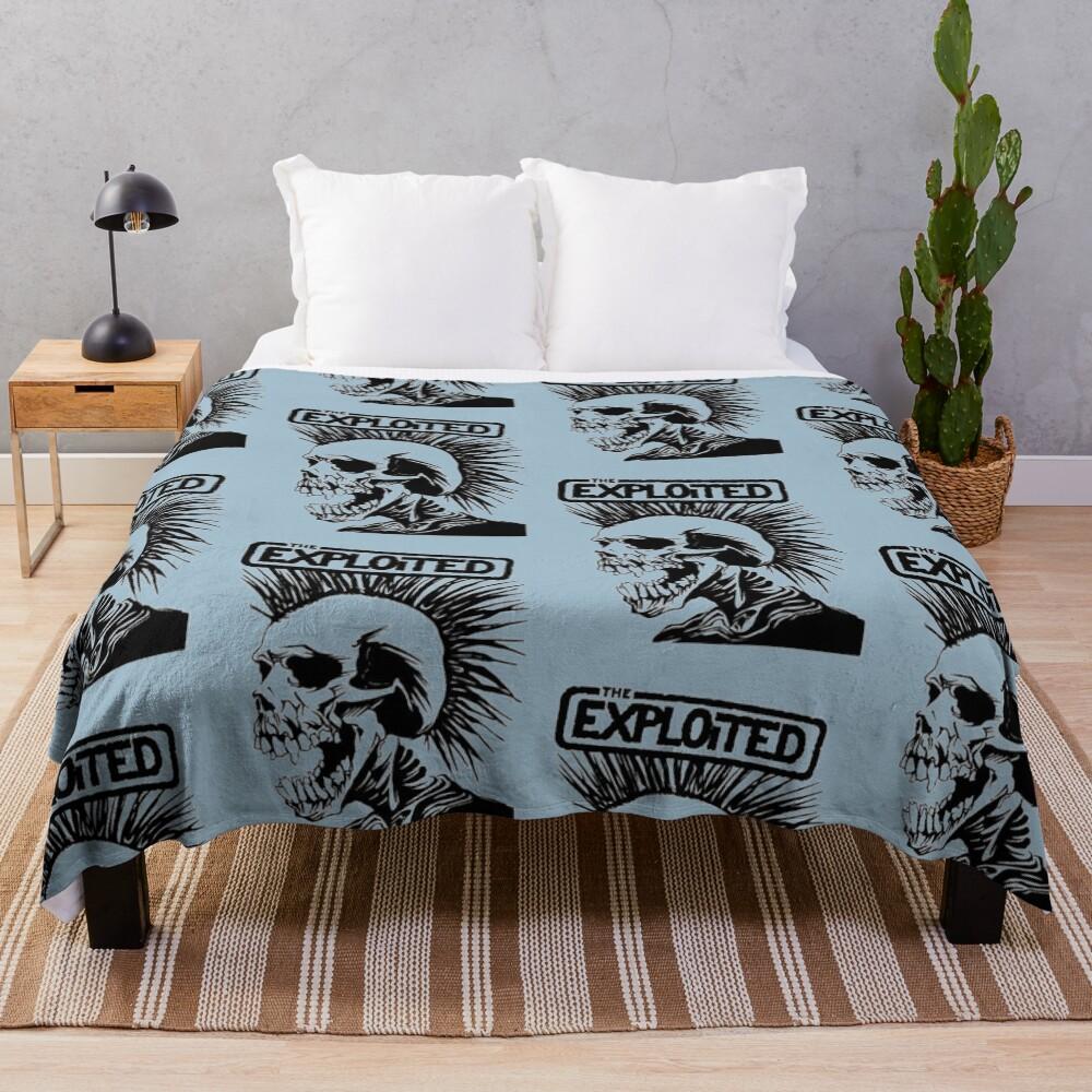 The exploited Throw Blanket
