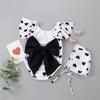 2024 Korean Girl's One-Piece Swimsuit: Black & White Heart with Bow and Lotus Leaf Sleeves.