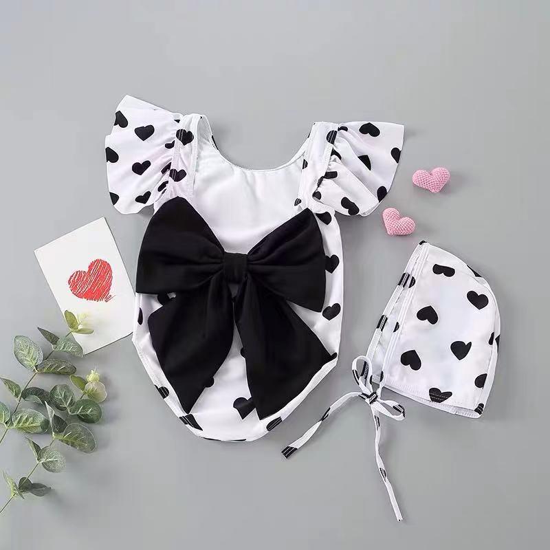 2024 Korean Girl's One-Piece Swimsuit: Black & White Heart with Bow and Lotus Leaf Sleeves.