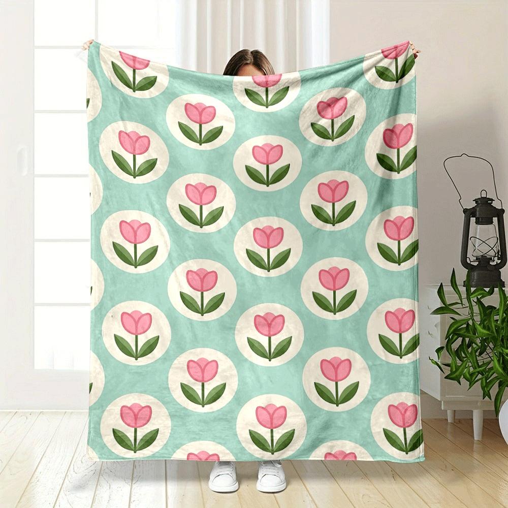 Pink tulips within white circles on a teal background. for all seasons blanket lunch break throw gift