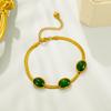 Luxury minimalist pendant necklace with shimmering emerald geometric design
