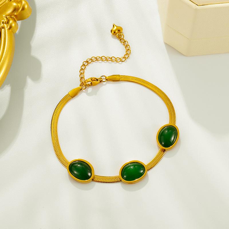 Luxury minimalist pendant necklace with shimmering emerald geometric design