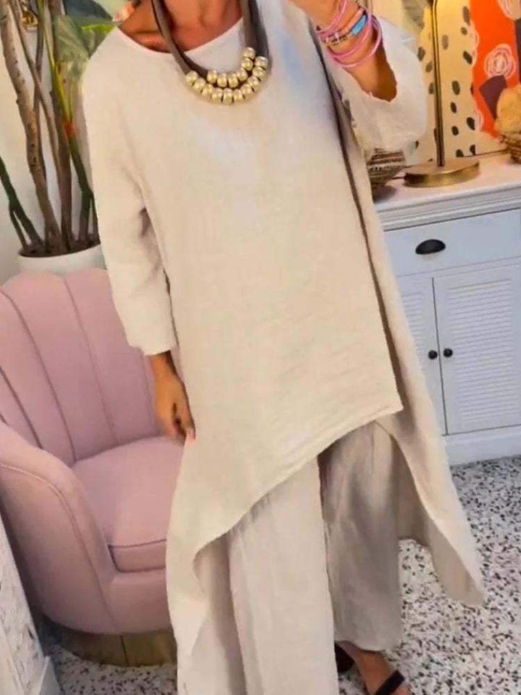 Женский комплект из свободной блузки с асимметричным подолом и брюк широкого кроя в нескольких цветах