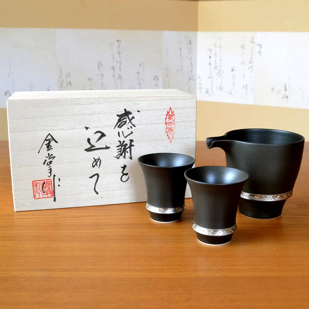 A Stylish Arita Ware Sake Set Featuring a Sake Bottle and Two Sake Perfect for Retirement Features Include a Finish and a Wooden Cups, Gifts.