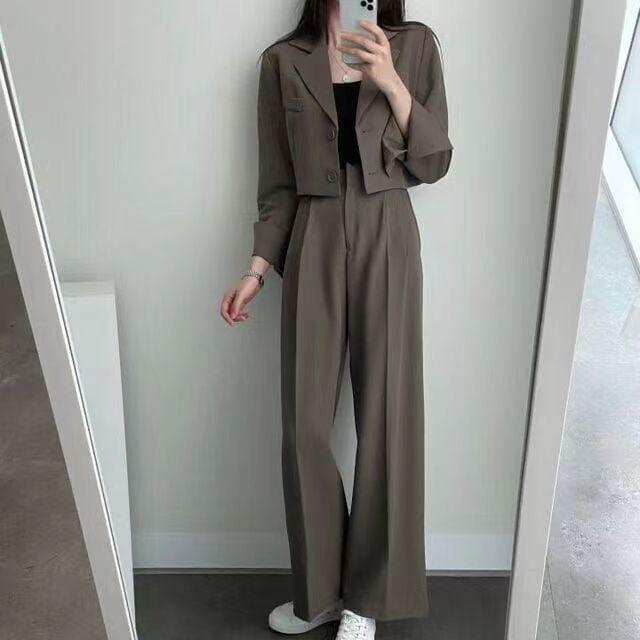 Women's Korean Style Lapel Suit: Two-Piece Set with Short Jacket and High-Waist Wide-Leg Trousers.