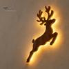 Battery Operated Wall Sconce Christmas Reindeer Light, Wooden LED Silhouette with Warm Backlight, Peel And Stick Art Lighted Festive for Holiday Home