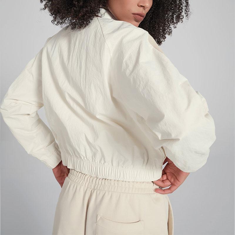 Reebok Ретро Спортивный воротник-стойка Короткая цветная тканая куртка женская куртка бежевая 24SRC106WGW1