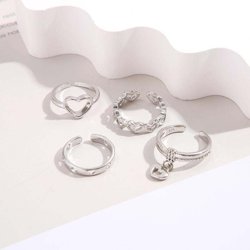 4-Piece Set Of Creative Hollowed-Out Heart Rings Featuring Minimalist Style With Open Knuckles Index Finger Exuding Elegance