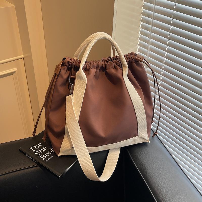 Canvas bag, female tote bag, large-capacity messenger 2025 new spring and summer versatile college student class commuting bag