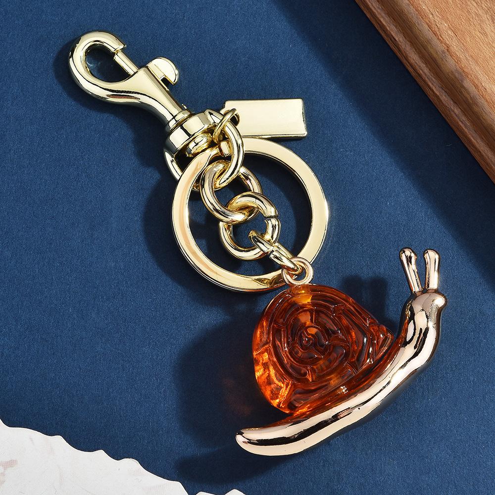 Retro Gold Oil Drop Snail Keychain Multi-Color Glitter Bag Pendant Light Luxury Niche Car Key Chain Versatile Pendant