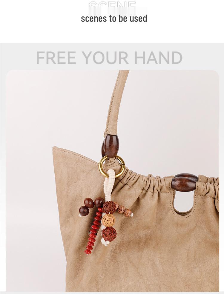 Wish-Fulfilling Bodhi Seed String Bag Charm - Hand-Woven Natural Keychain Ornament with Turquoise.