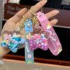 Подвеска-брелок в виде звезды из акриловых желейных бобов с масляным наполнением в виде зыбучего песка