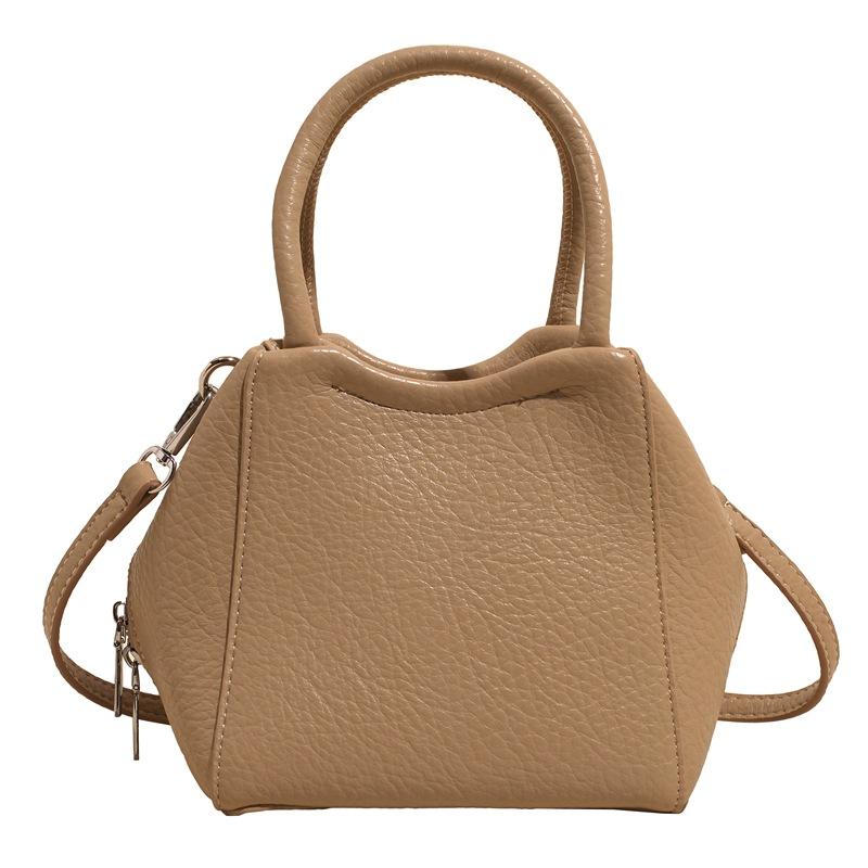 Оптовая мода высокое чувство простой стиль однотонный узор личи сумка-ведро повседневная универсальная сумка-мессенджер для通勤 для женщин