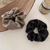 Satin-Feel Scrunchie: Versatile Luxury Hair Tie for Women, Elevates Style & Compliments Skin Tone.