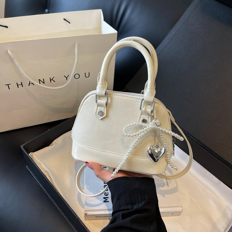 В этом году популярная маленькая сумка женская 2024 новая мода высокая чувственность оболочка сумка через плечо Интернет знаменитость взрыв портативный