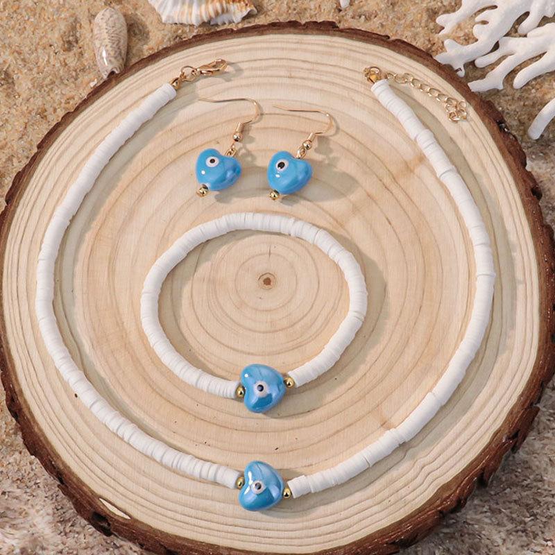 Bohemian vacation style egg flower necklace earrings set ins niche flower soft pottery color collarbone chain tide