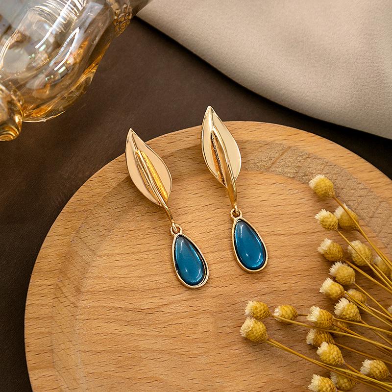 "European & American Retro Turquoise Feather Earrings: Bohemian Dragonfly, Bird, Water Drop, Round, & Pearl Designs"