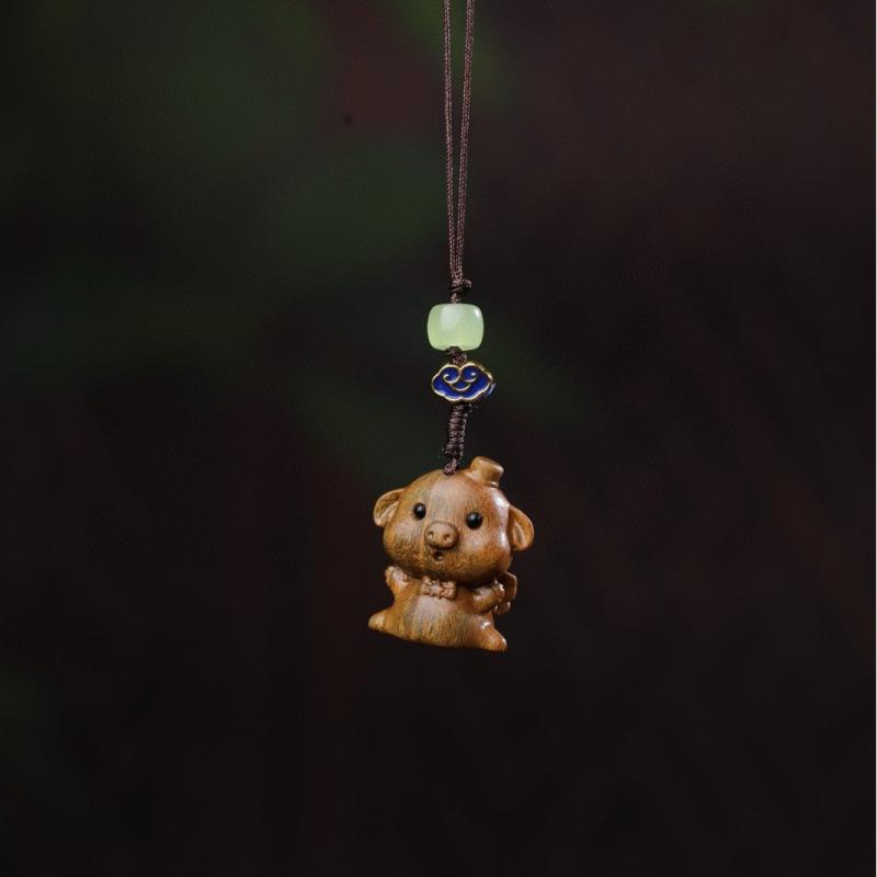 Twelve Zodiac Animal Charms Green Sandalwood Set: Rat, Ox, Tiger, Rabbit, Dragon, Snake, Horse, Sheep, Monkey, Rooster, Dog, Pig.