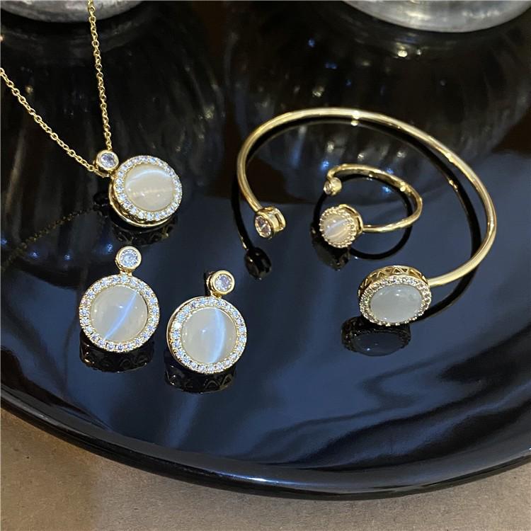 Elegant Women's Rotating Necklace Set with Round Cat's Eye Stone and Diamond Accents