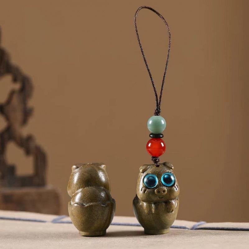 Twelve Zodiac Animal Charms Green Sandalwood Set: Rat, Ox, Tiger, Rabbit, Dragon, Snake, Horse, Sheep, Monkey, Rooster, Dog, Pig.