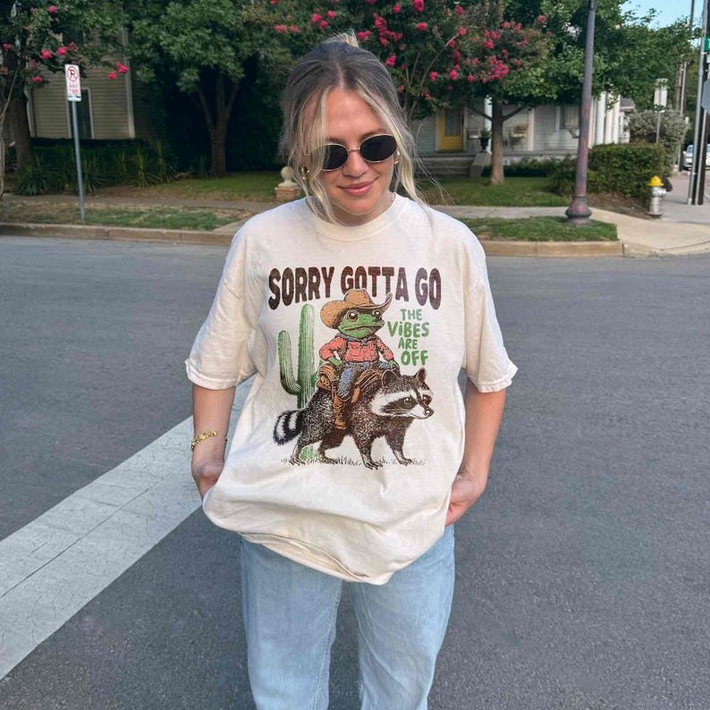 Cowboy Frog Riding Raccoon Shirt The Vibes Are Off Weird Unisex Shortsleeved Retro Street Casual Fashion Tops Clothing