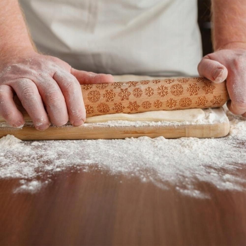 Wooden rolling pin with Christmas patterns and decorative engraving
