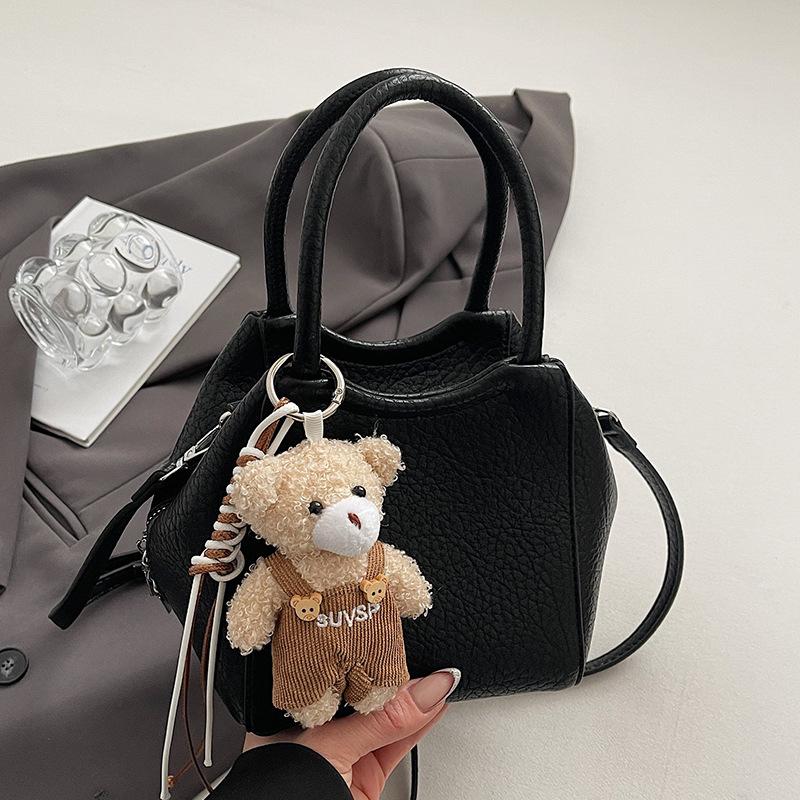 Оптовая мода высокое чувство простой стиль однотонный узор личи сумка-ведро повседневная универсальная сумка-мессенджер для通勤 для женщин