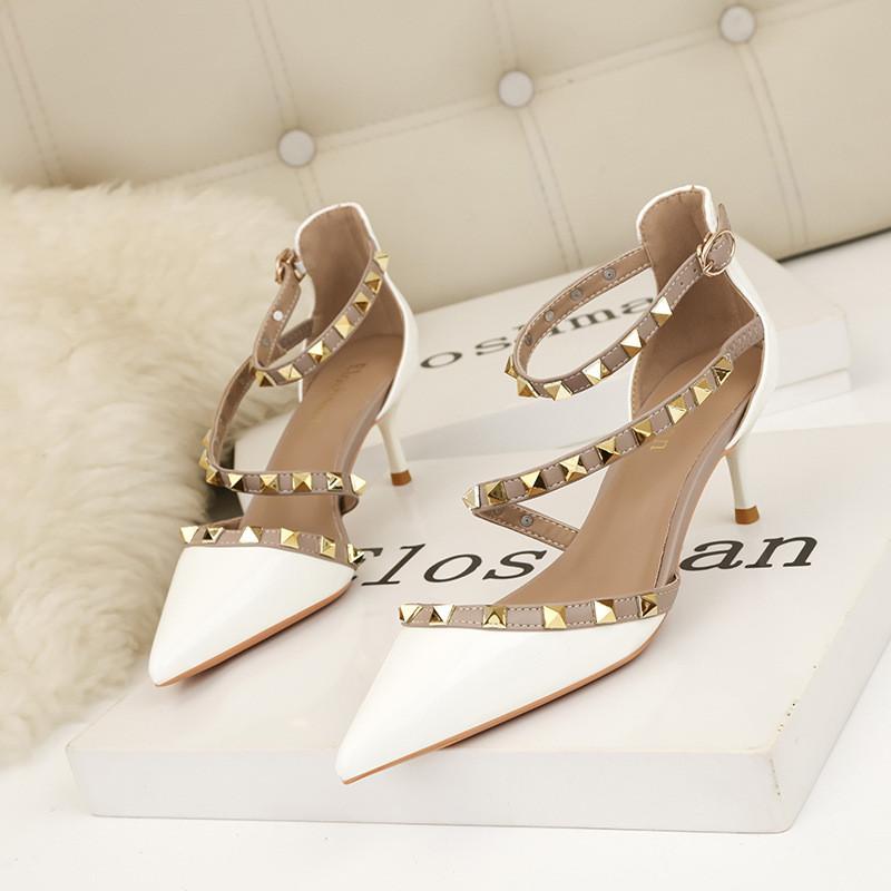 European and American simple and sexy nightclub stiletto high heels shallow mouth pointed rivets hollow word with sandals