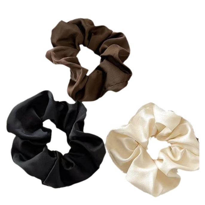 Satin-Feel Scrunchie: Versatile Luxury Hair Tie for Women, Elevates Style & Compliments Skin Tone.