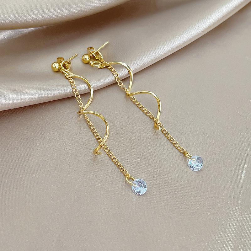 Серебряные серьги-кисточки с иглами и цирконами - модные женские украшения
