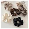 Satin-Feel Scrunchie: Versatile Luxury Hair Tie for Women, Elevates Style & Compliments Skin Tone.