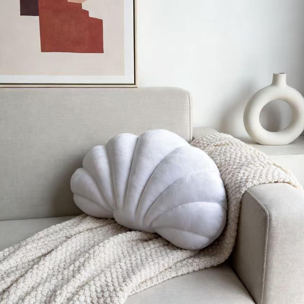 A seashell-shaped pillow, suitable for living room sofas, bedrooms, offices, and home decor.