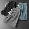 Men Summer Athletic Shorts Mid-rise Elastic Drawstring Waist Shorts Pockets Wide Leg Running Shorts Solid Color Thin Quick Drying Ice Silk Shorts