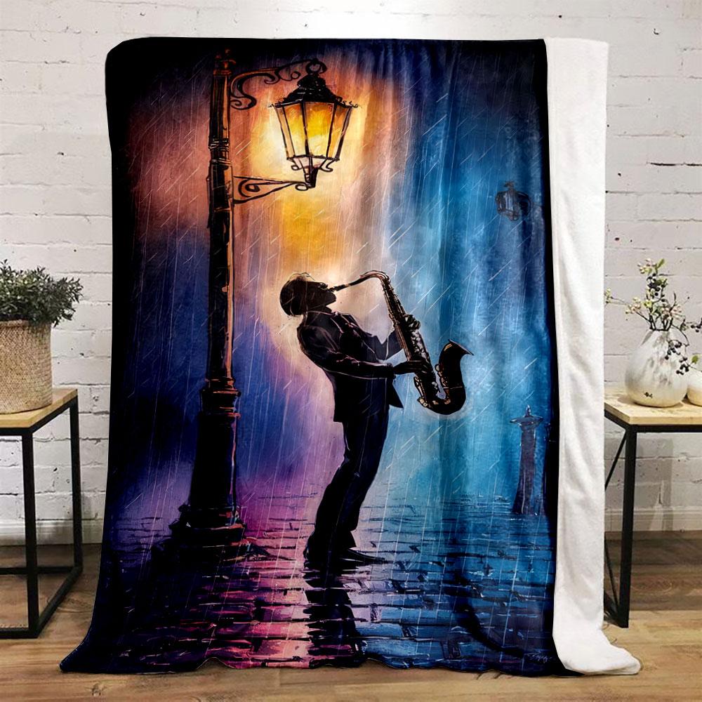 A silhouette of a saxophonist under a glowing streetlamp in rainy hues. for all seasons blanket lunch break throw gift