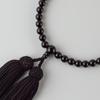 Похоронные четки из черного оникса Сато для женщин. Могут использоваться представителями всех конфессий. Сделаны в Киото с ношением вместе с четками для молитвы. Бусина года сна.