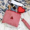 Red cherry canvas makeup bag, portable and easy to carry. Red plaid, large capacity cosmetic lipstick storage bag.
