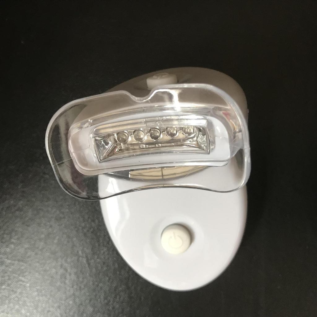 Qiao Qiang Mini Whitening Tooth Lamp: Portable Cold Light Device with Gel for Teeth Whitening, In White or Blue.