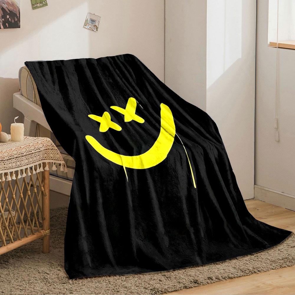 A yellow smiley face with X-shaped eyes on a black background. for all seasons blanket lunch break throw gift